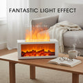 White fireplace diffuser on a wooden coffee table in the living room, demonstrating the fantastic flame light effect using mist and light technology.